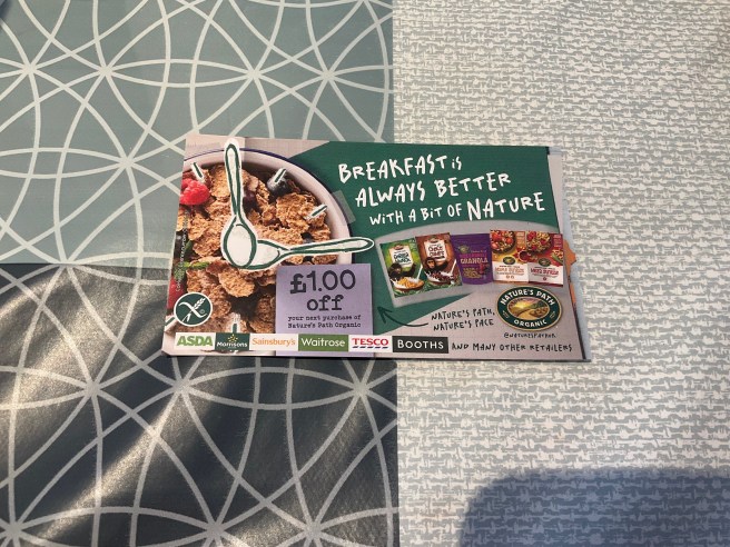 A Nature's Path flyer lies on a tablecloth with duck egg colour scheme patterns.